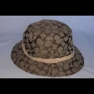 Coach bucket hat. Tan and brown signature logo
